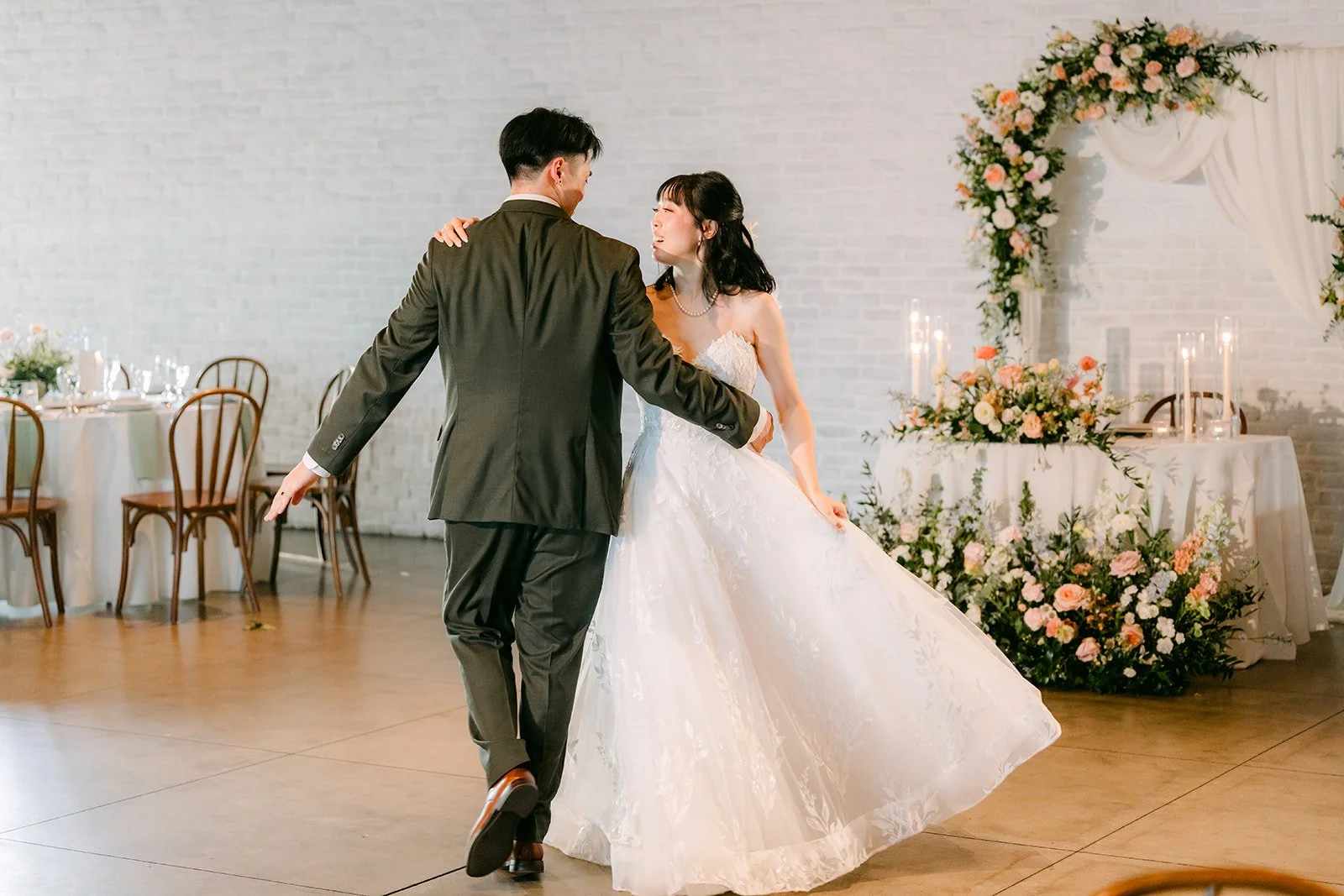 Couple dancing alone in the empty reception room