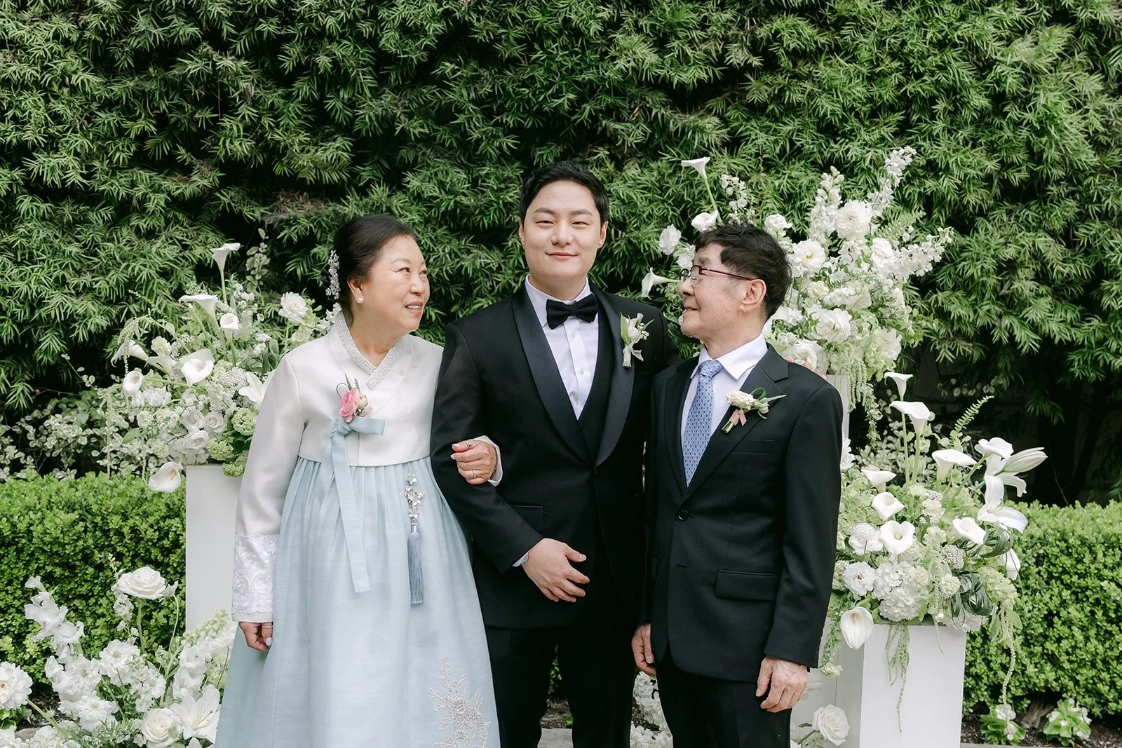 Min Soo with two family members after the ceremony