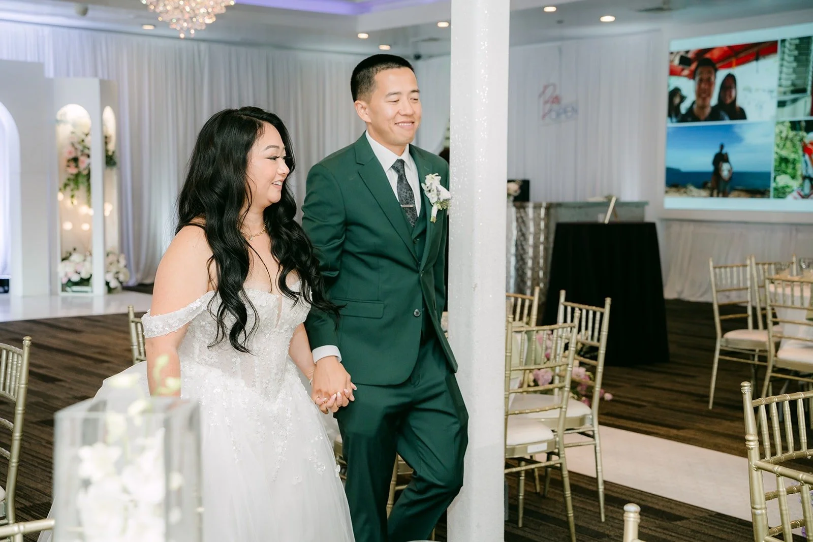 Jennifer and Kevin walk out onto the dance floor for their first dance