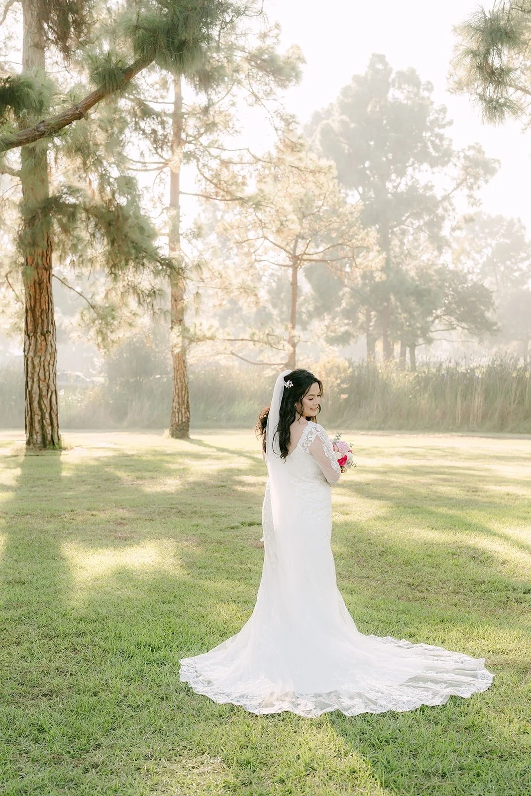 Full length portrait of Amy and her train among tall pines