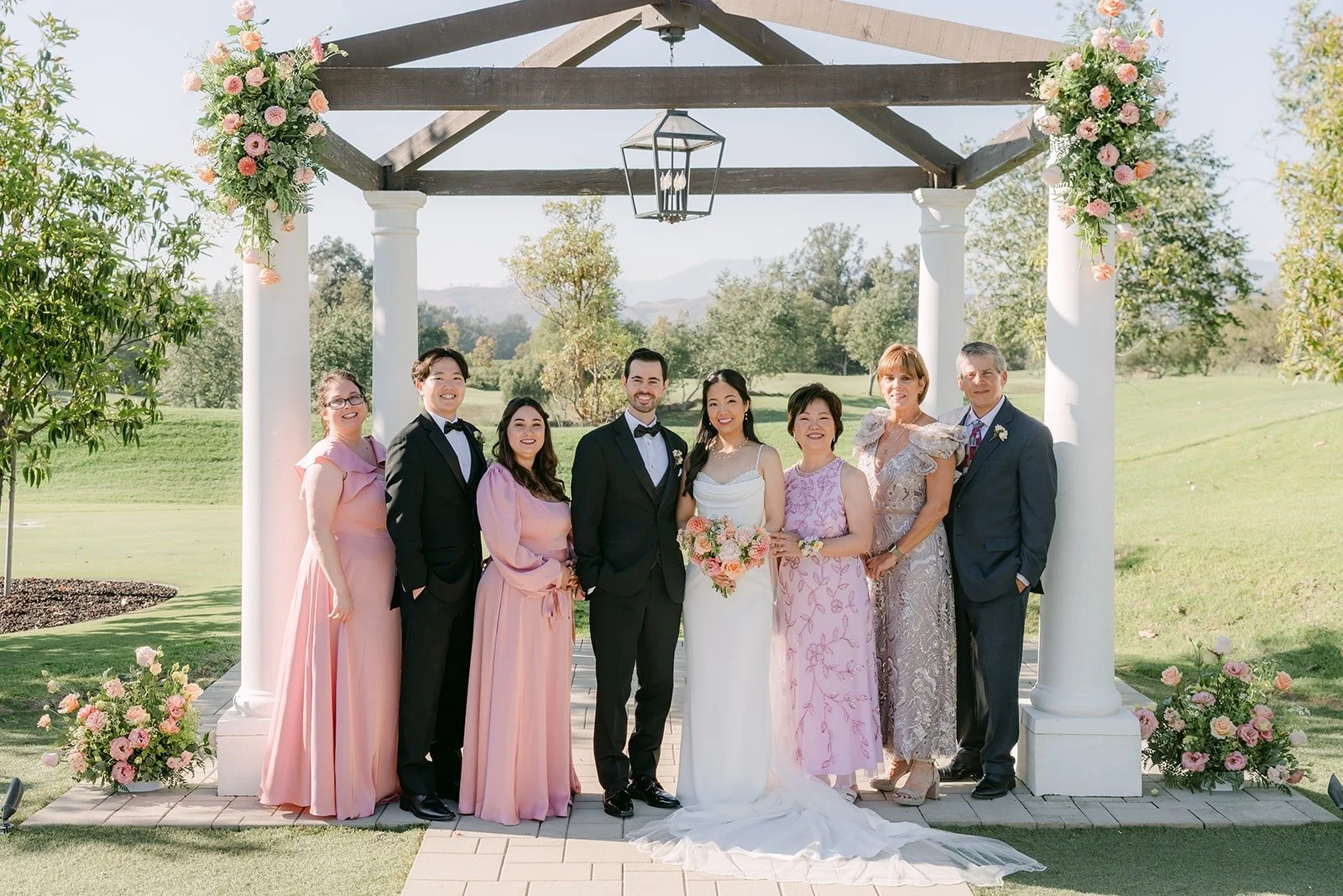 Stephanie and Kevin with family under the pagoda