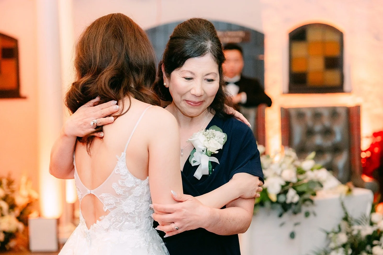Valerie hugging a parent during the parent dance