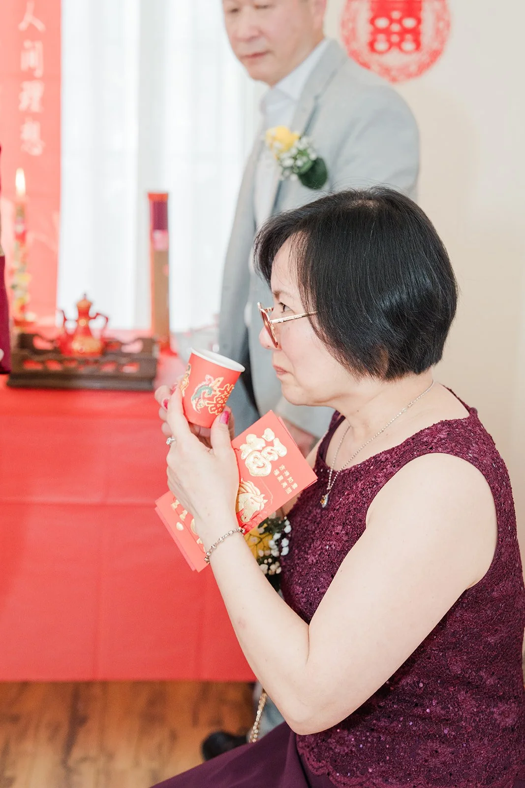 A relative smiling with a teacup.