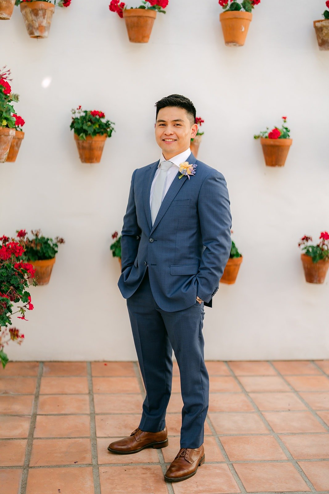 Jerrick waiting by the geranium wall for the first look