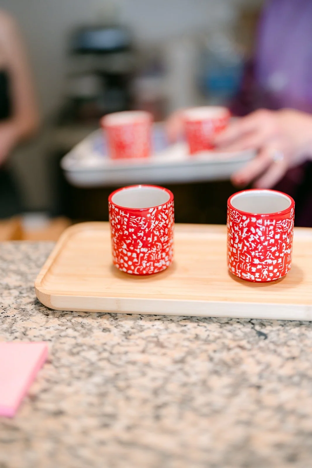 Red tea cups on a wooden tray ready for the tea ceremony