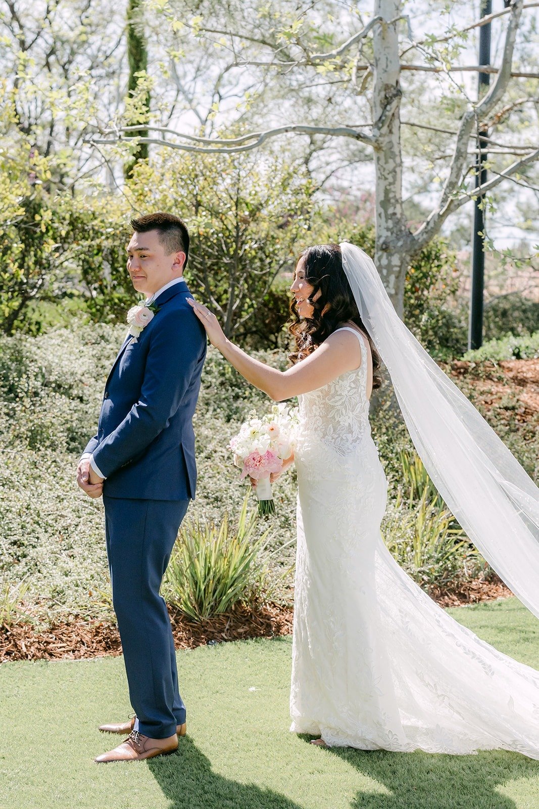 Kelli tapping Alex on the shoulder during their first look
