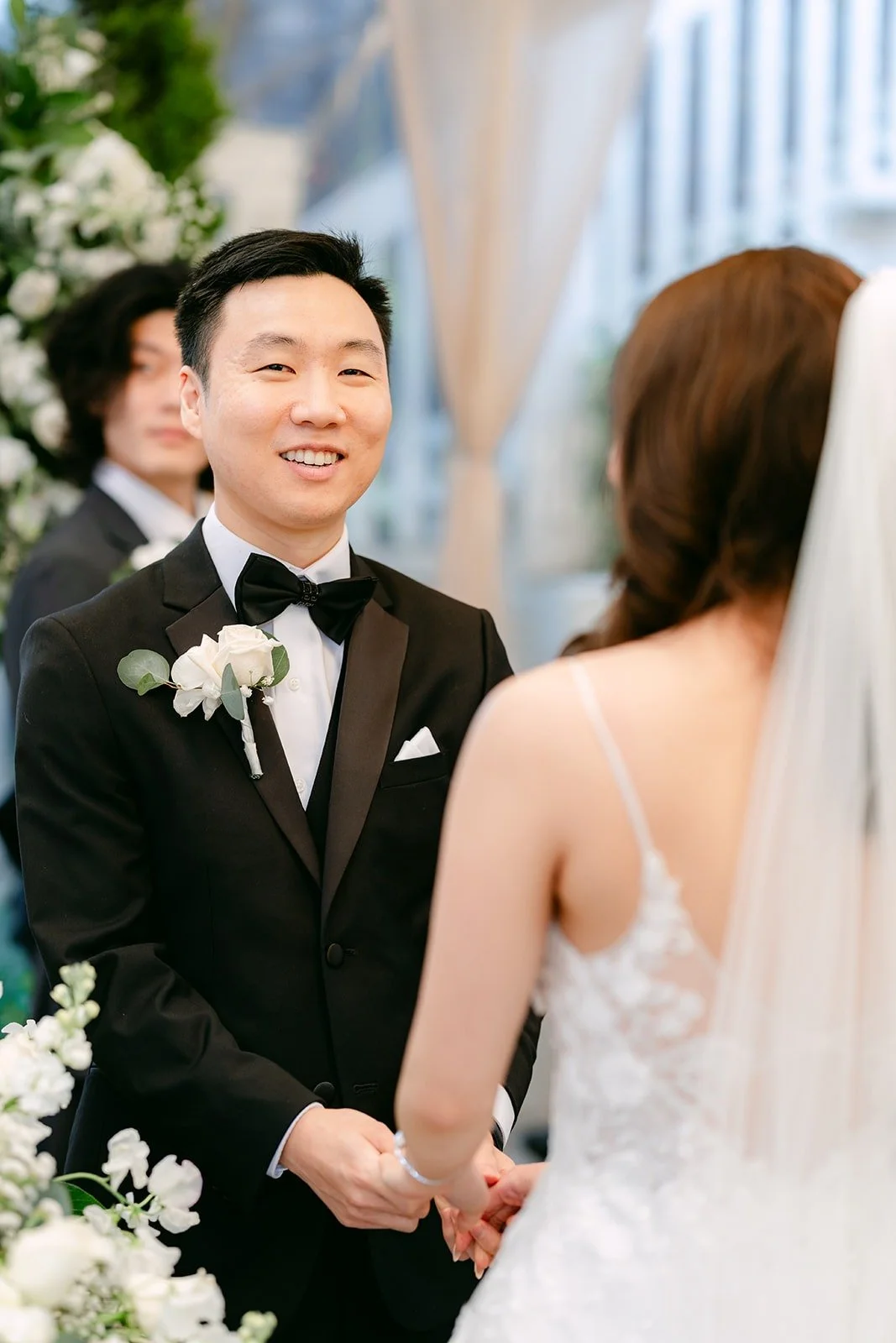 Jason smiling at Valerie as the ceremony begins