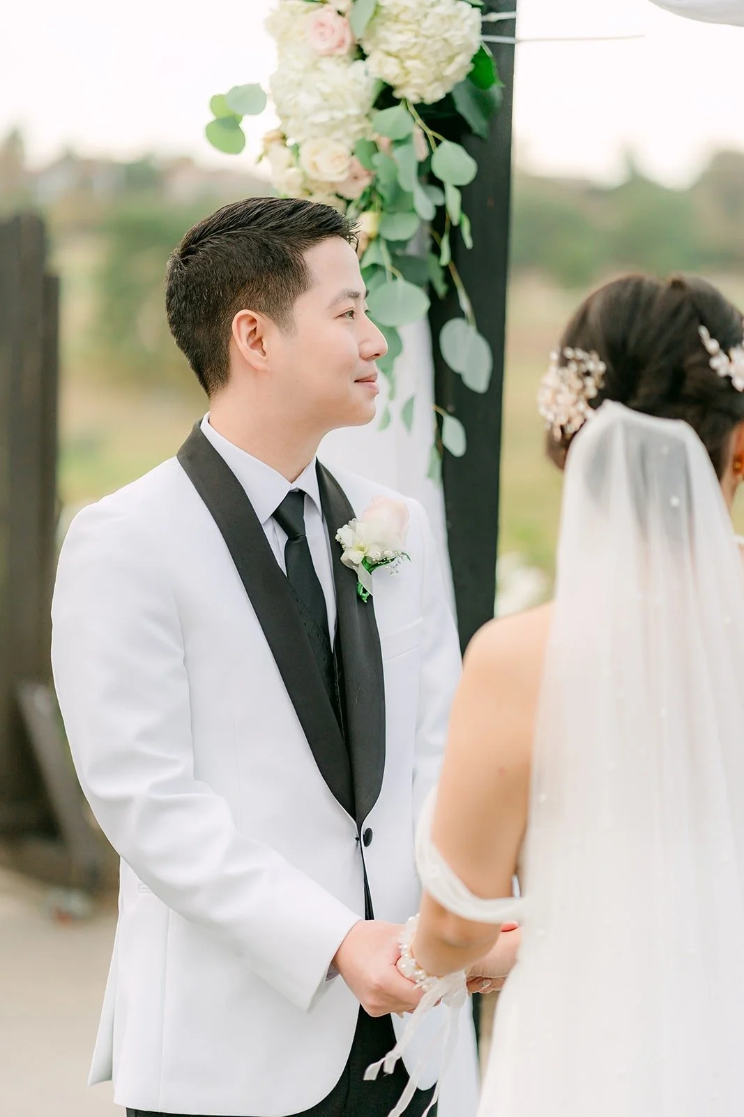 Chungman smiling at Ivy during the ceremony