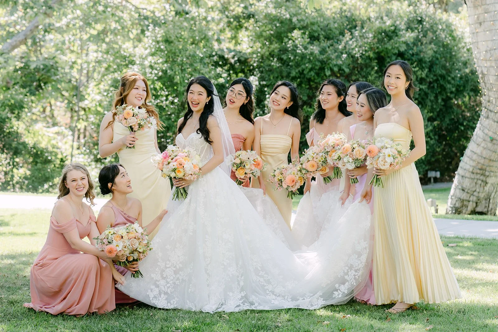 Wide view of Clarissa and her bridesmaids on the lawn