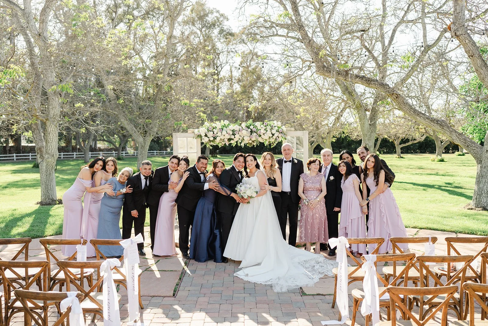 Full wedding party portrait at the ceremony site