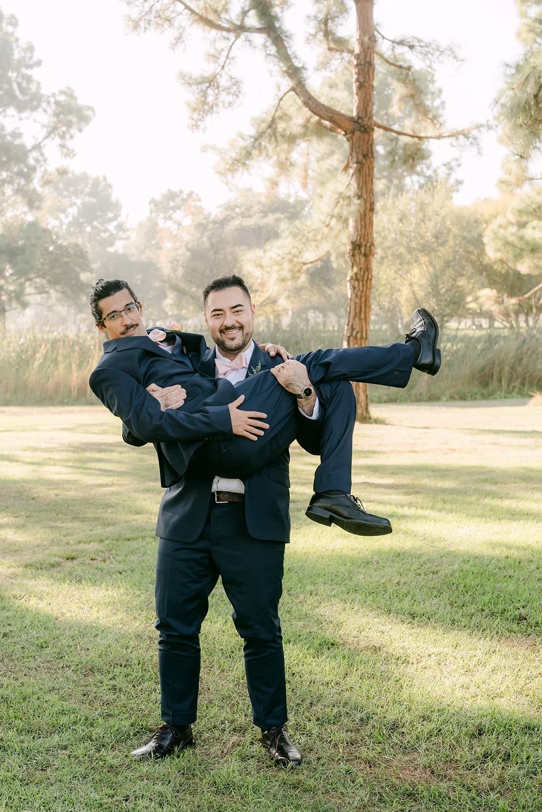 James getting lifted up by a groomsman