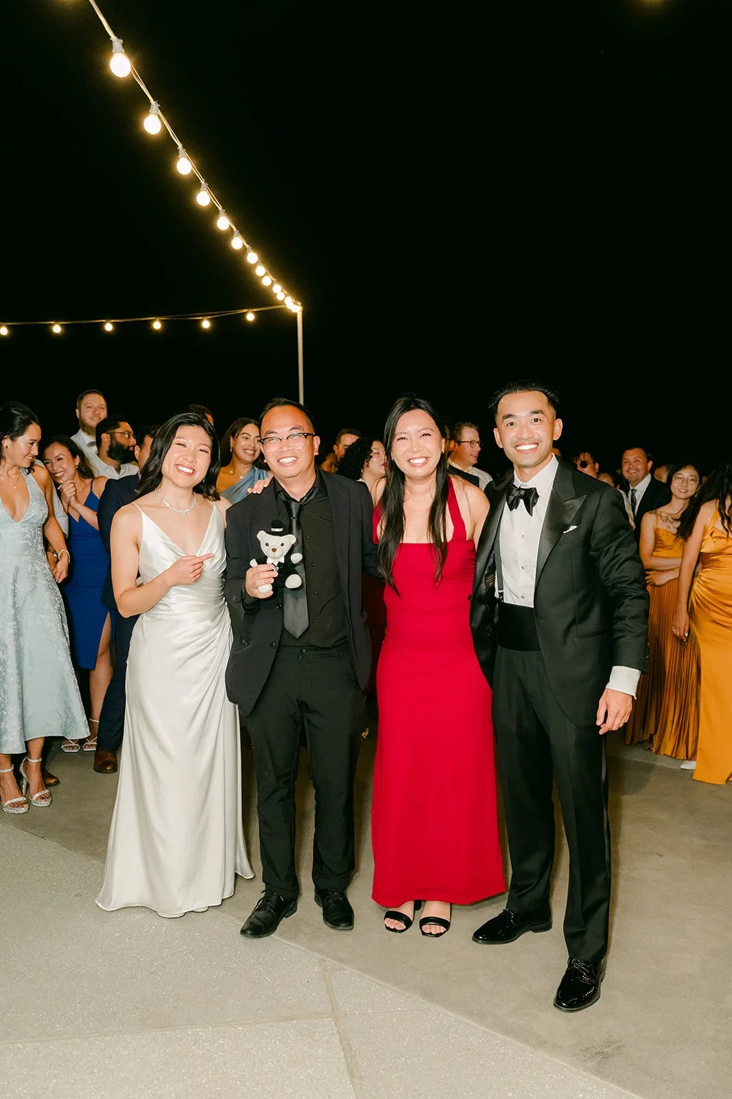 Kim and Vincent with friends after the bouquet toss