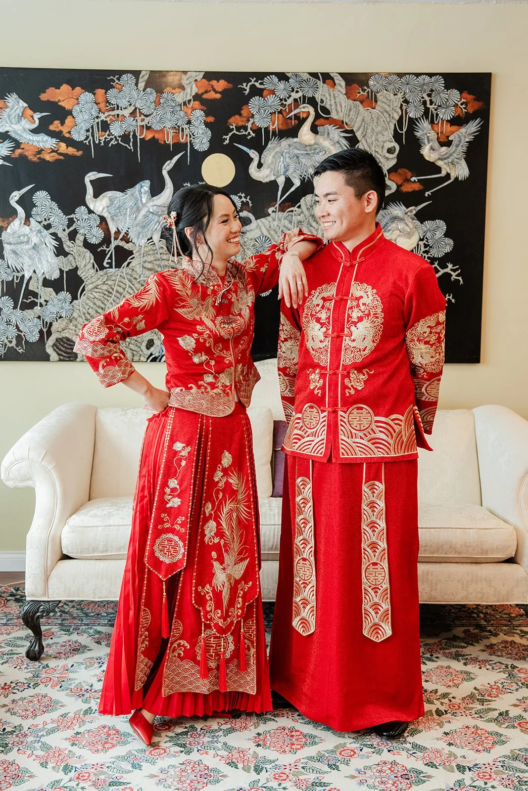 Bridgette and Henrik standing together in red qun kwa.