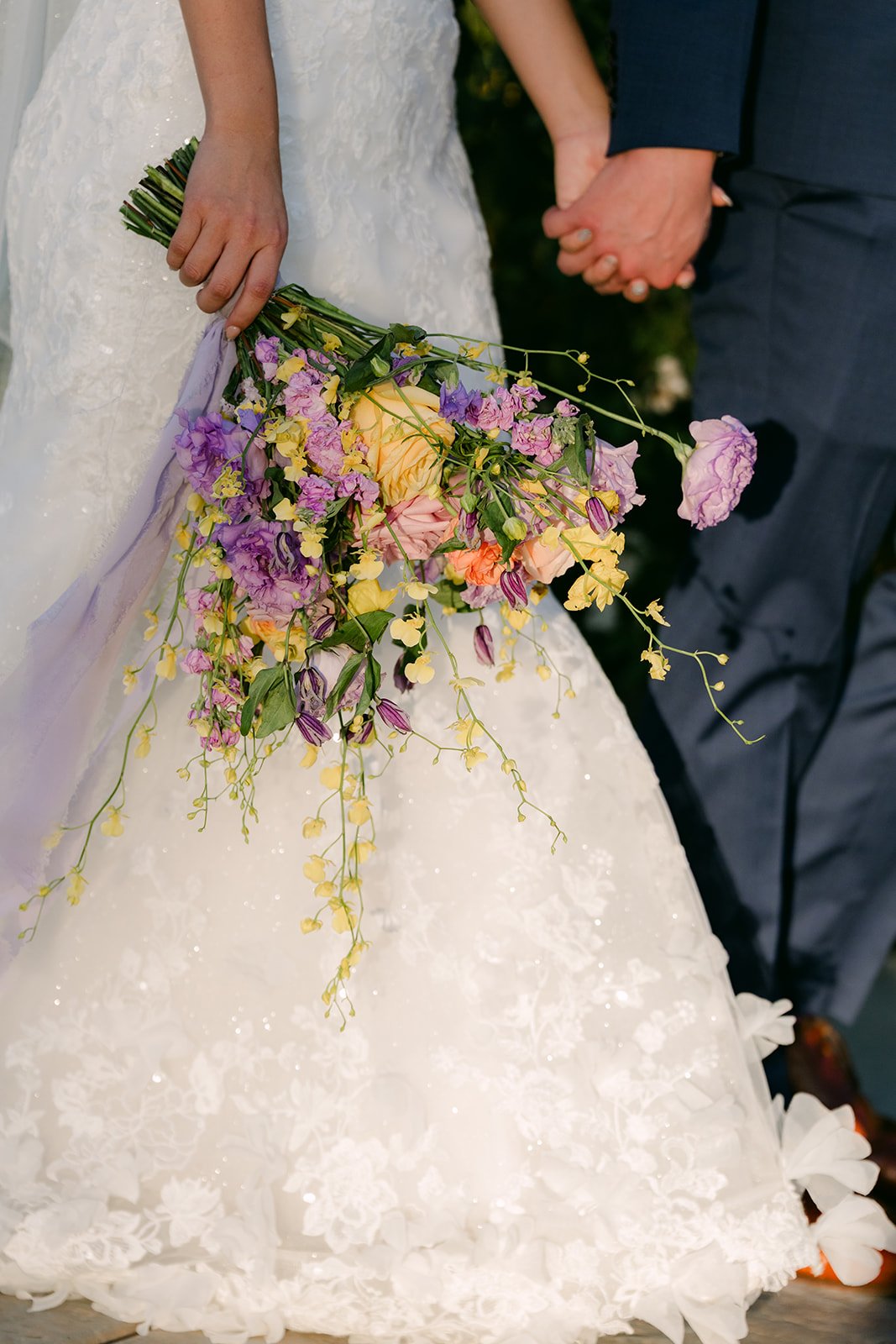 Close-up of the bouquet and Vannie's lace gown.