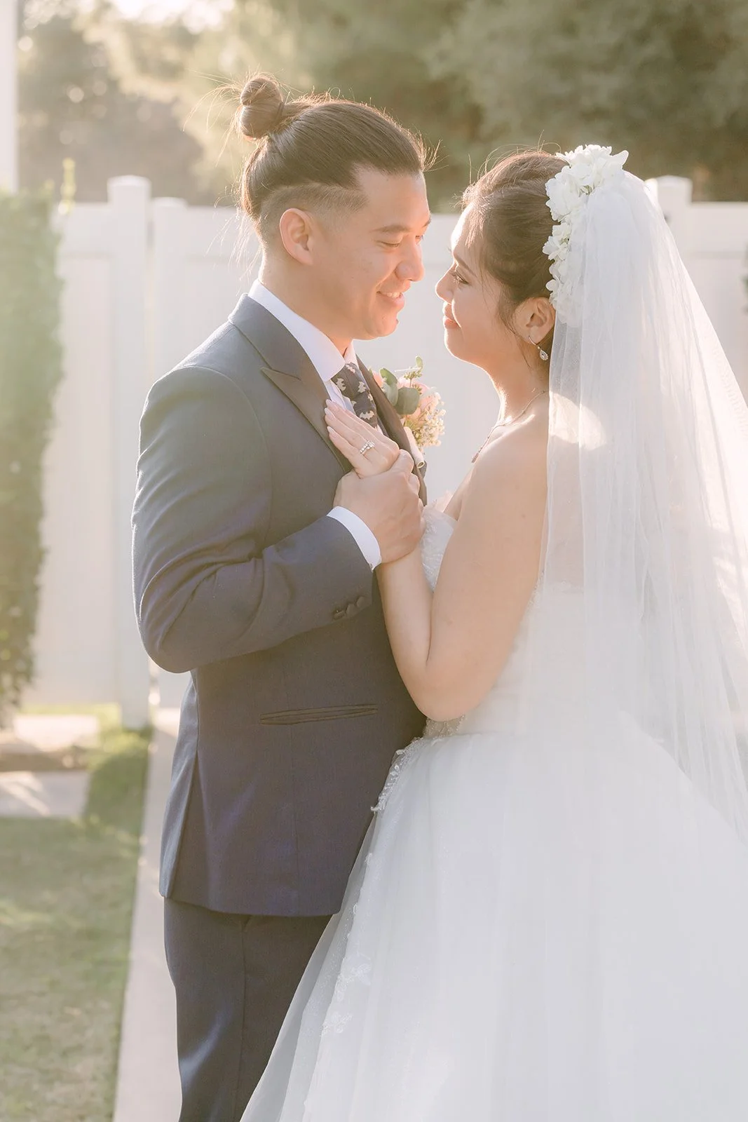 Kate and Michael embracing after their first look, photographed by One and Only Production.