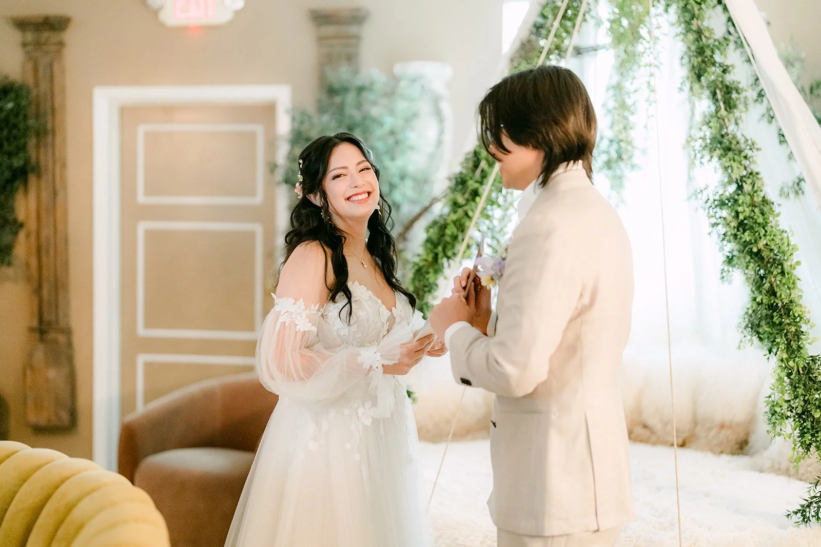 Kat smiling as Mike reads his private vows