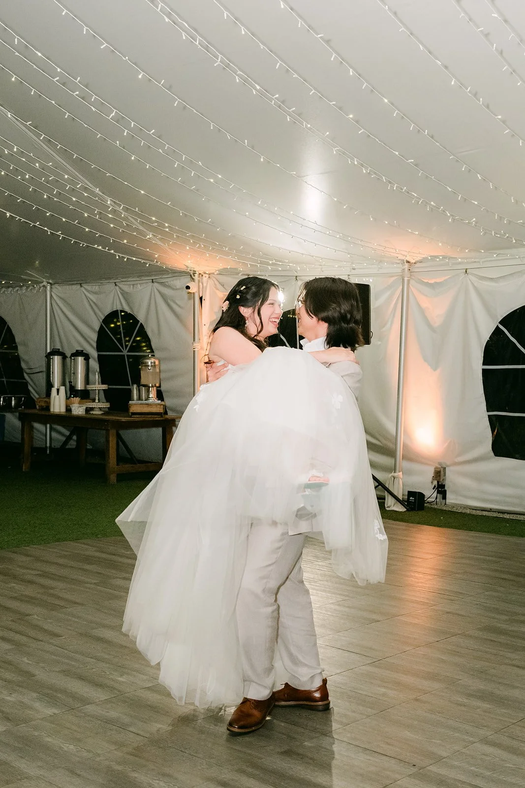 Mike lifting Kat during their first dance