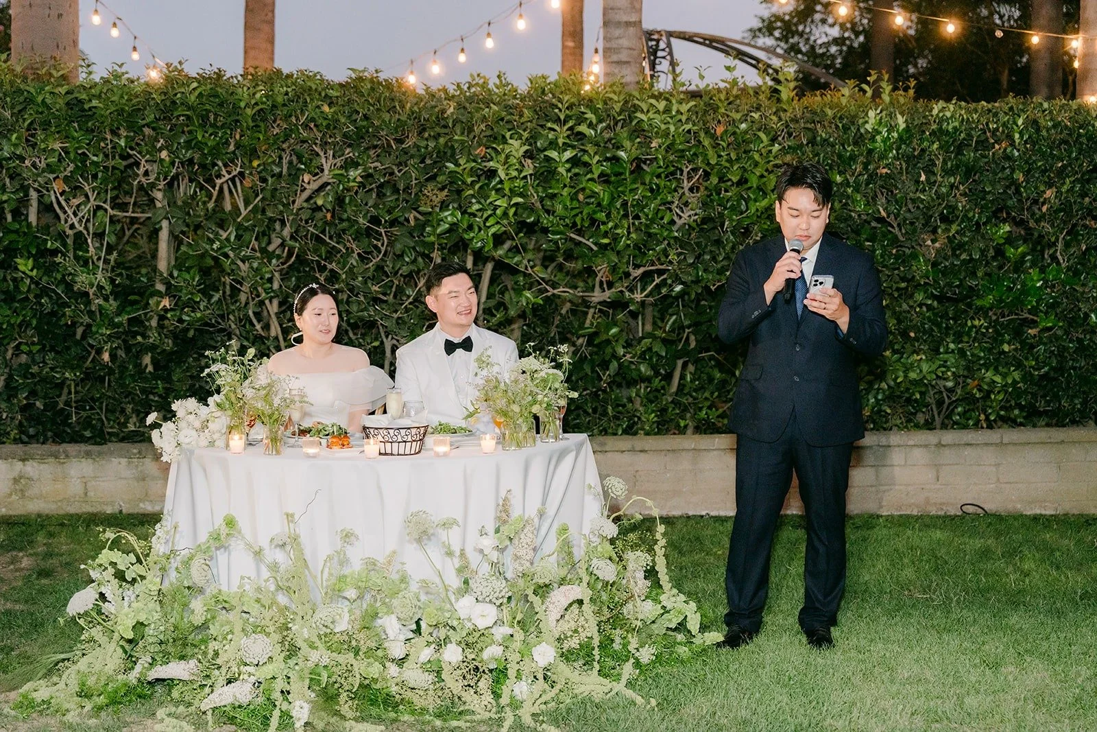 A toast from beside the sweetheart table