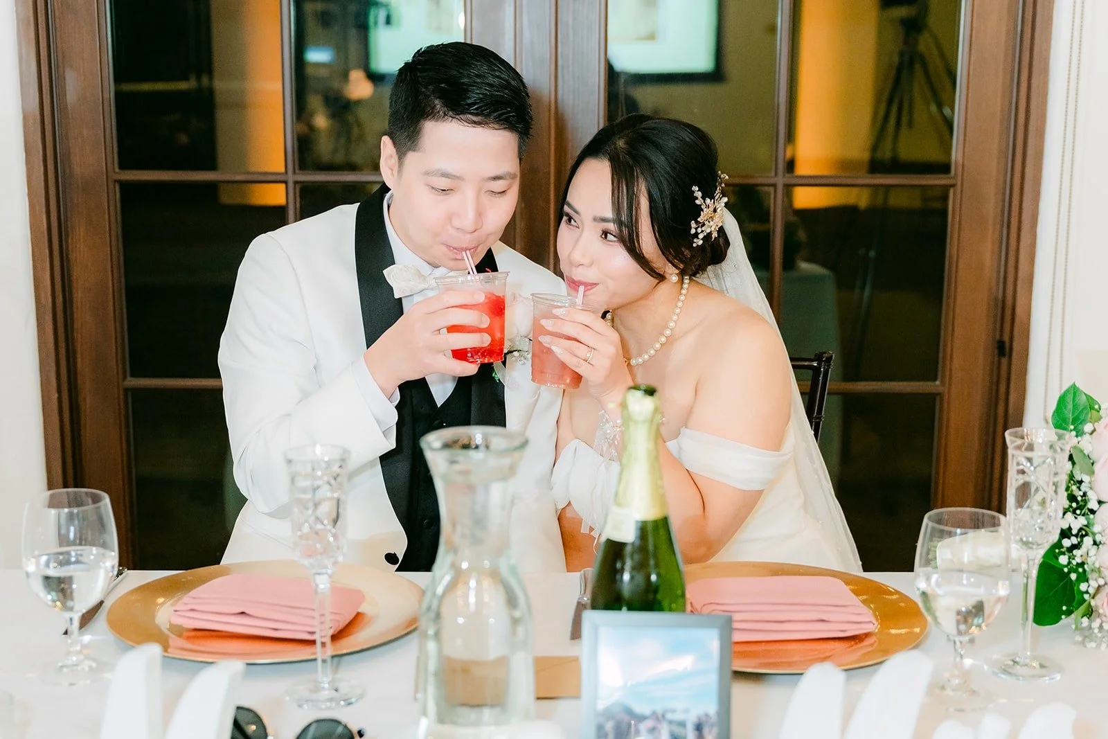 Ivy and Chungman toasting at the sweetheart table