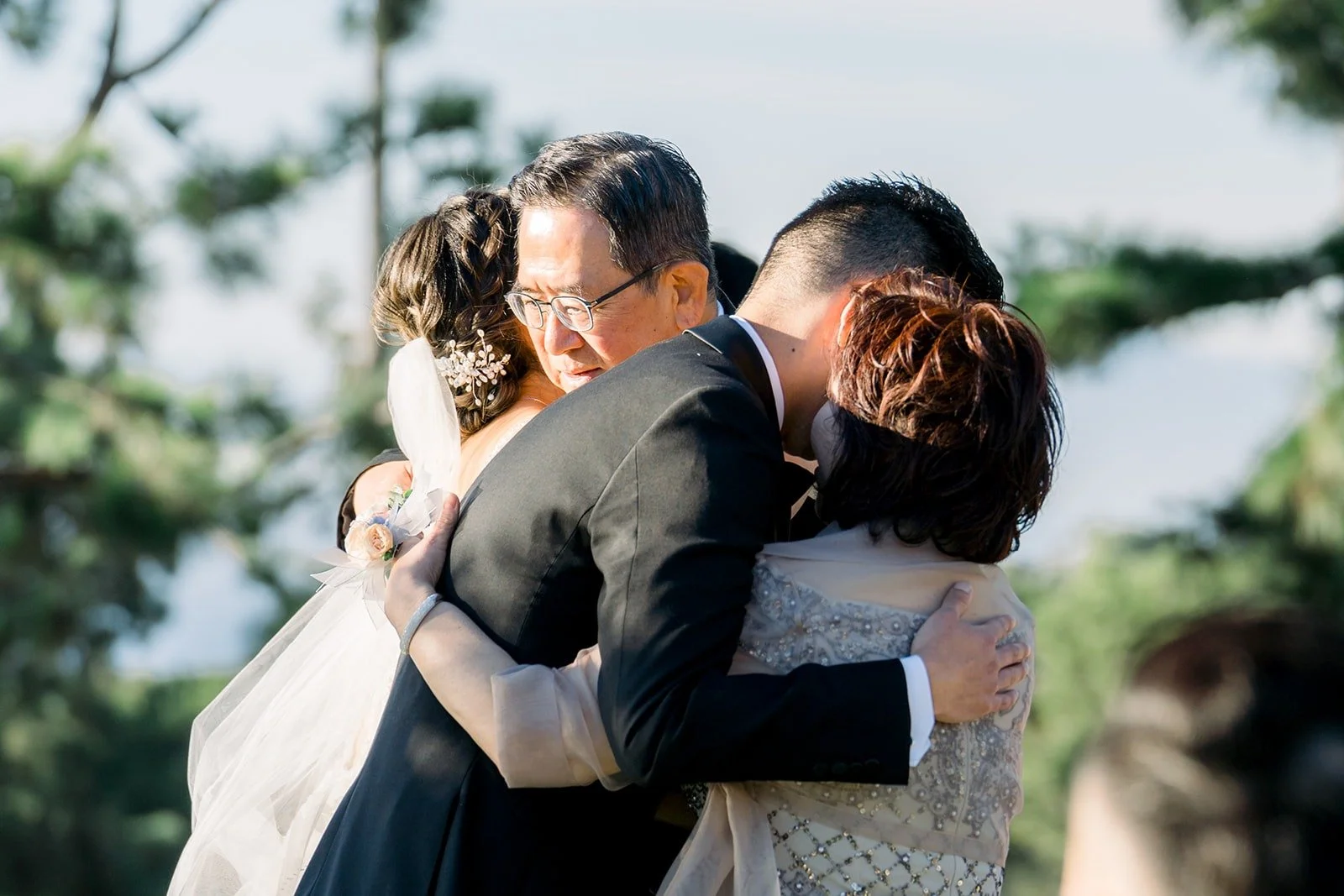 Josephine and David sharing a hug at the arch