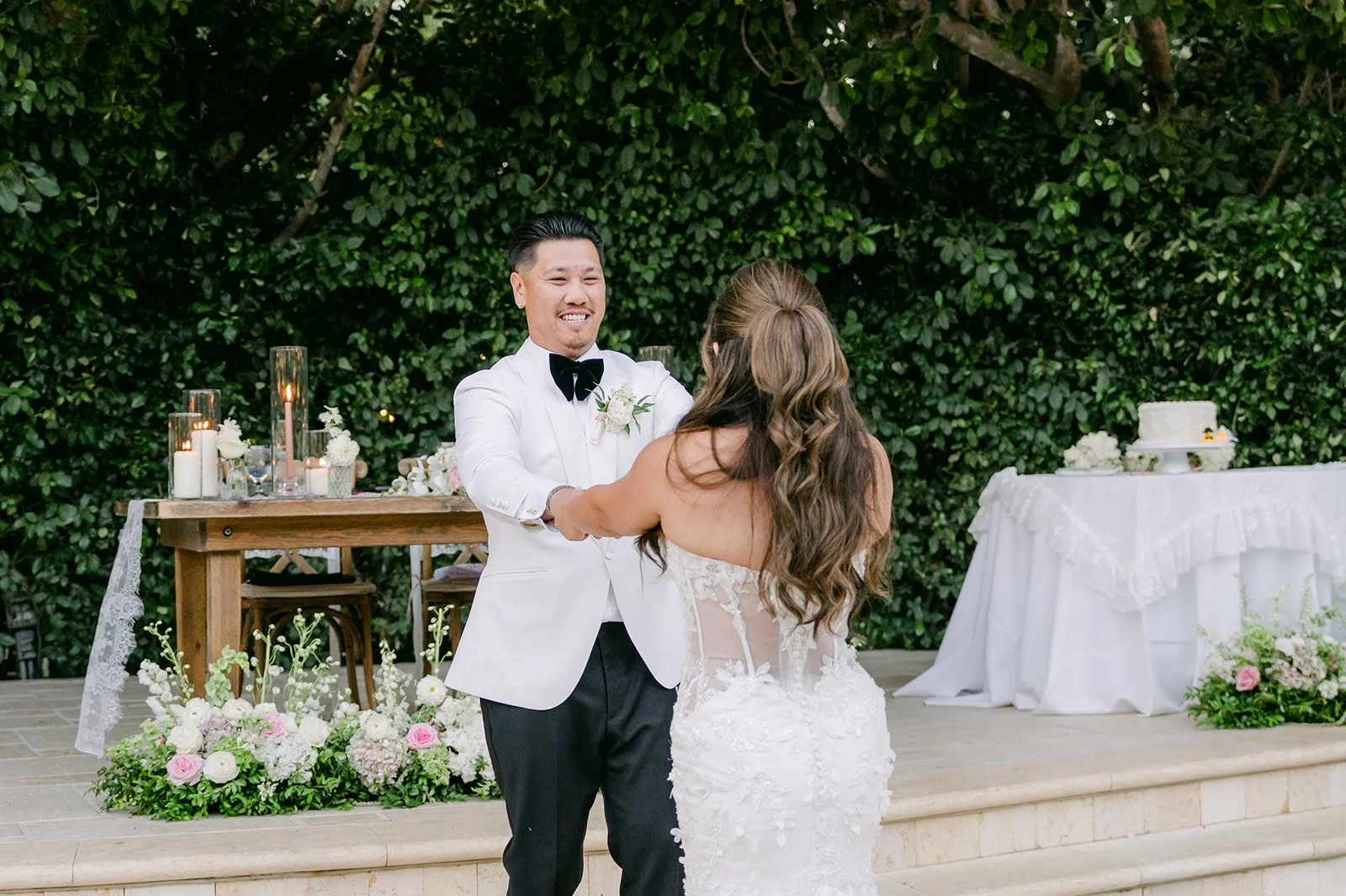 Caryl lifting Nicole during their lightly choreographed first dance.