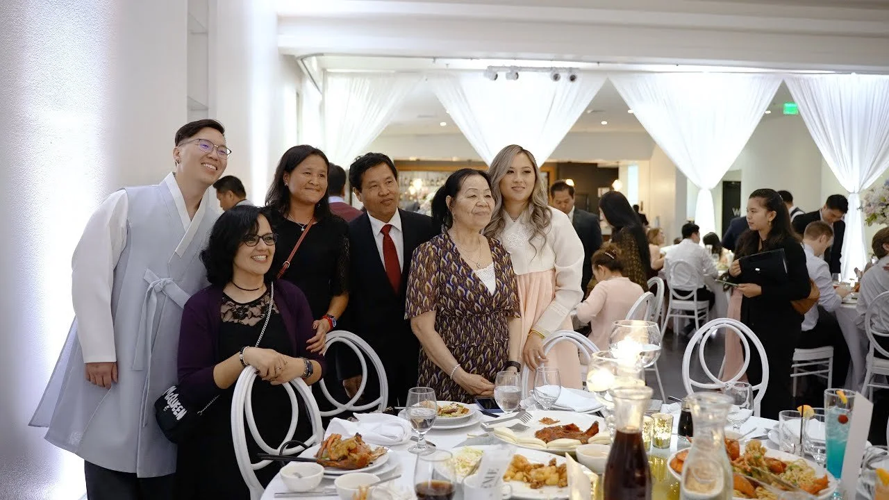 Video still of the couple greeting guests during table visits, filmed by One and Only Production