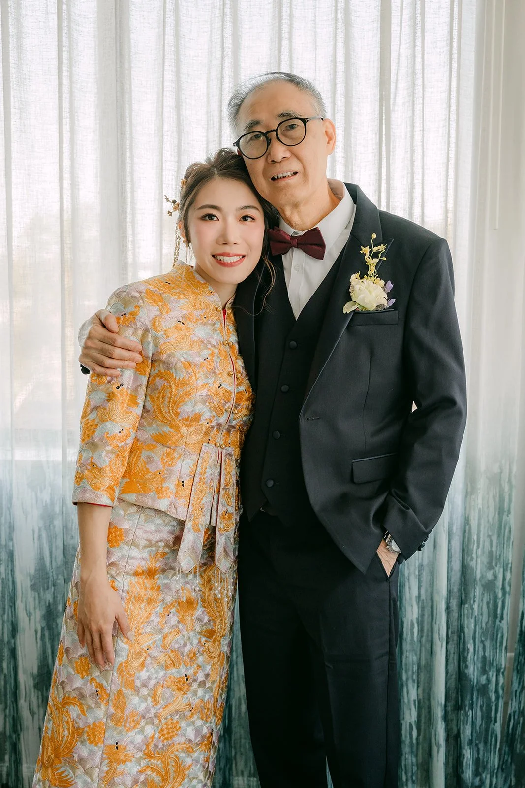 Christie and her dad posing together before the tea ceremony.