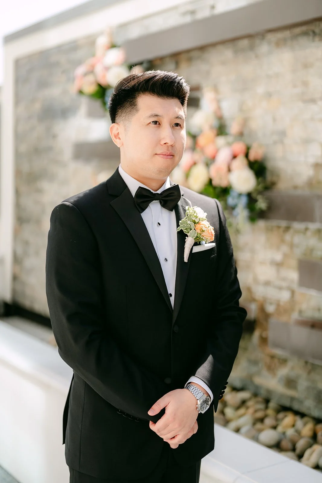 San waiting by the stone wall on the terrace before the first look.