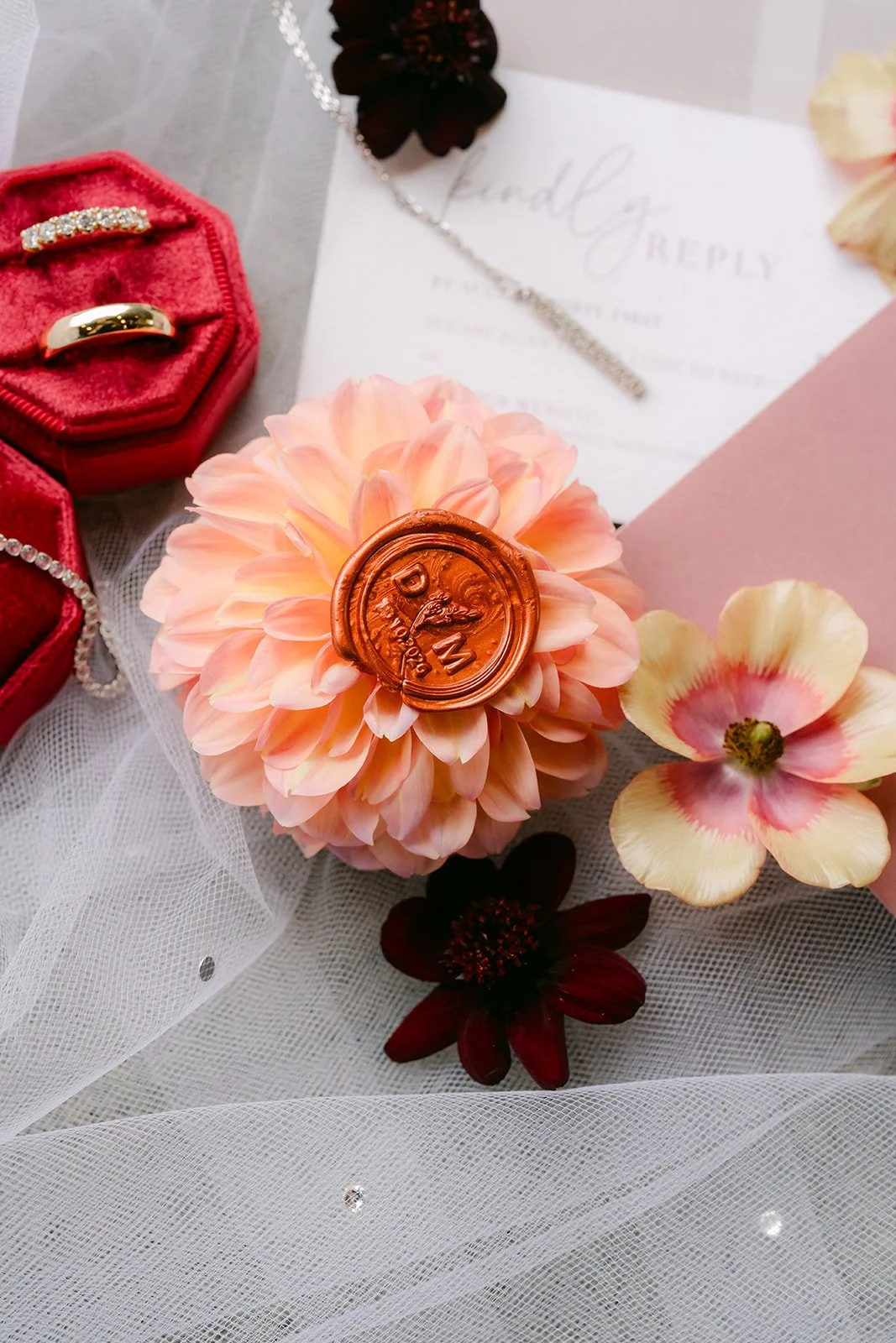 Wax sealed invitation, peach dahlia and red ring box, photographed by One and Only Production.
