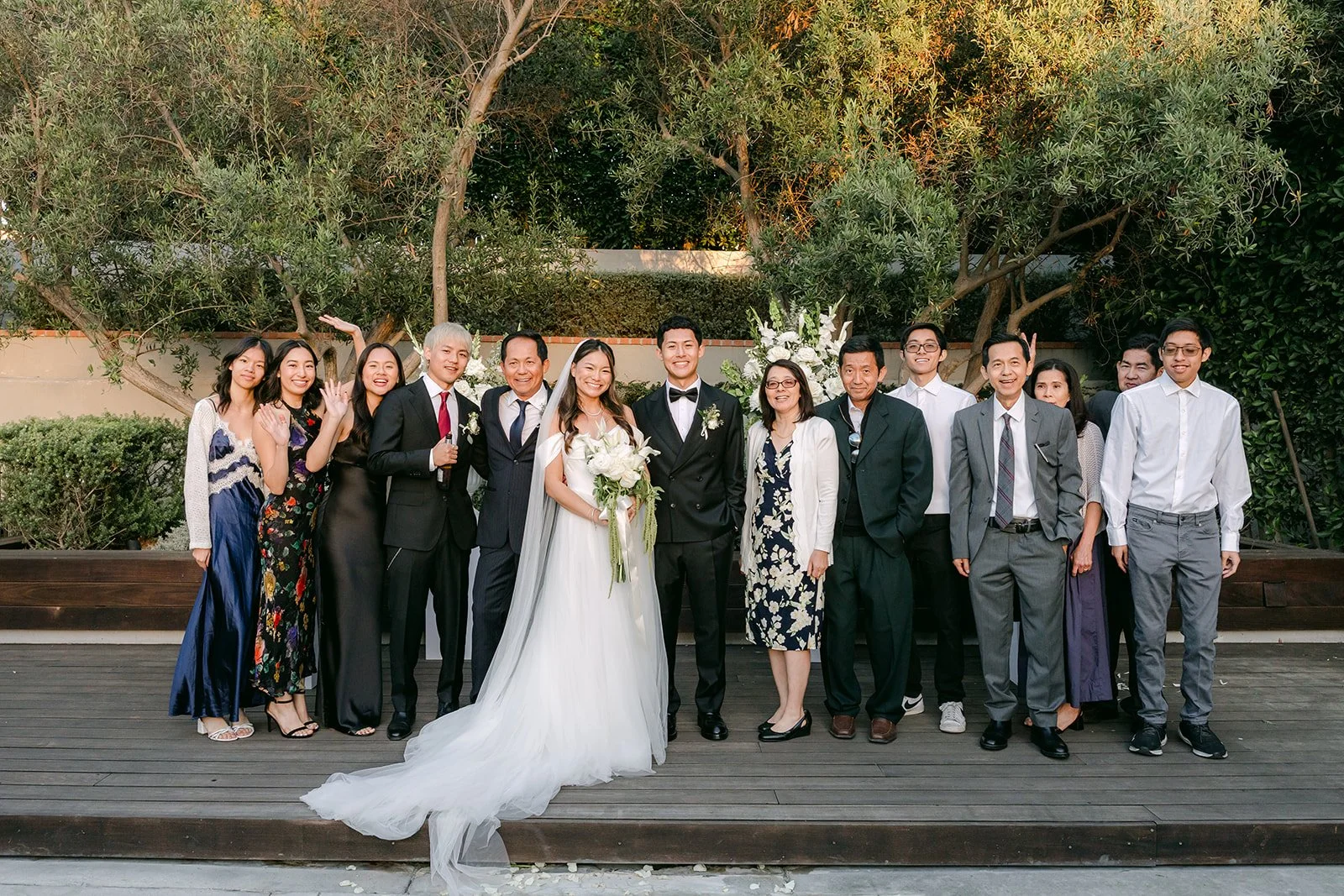 Big family group photo in the garden, photographed by One and Only Production