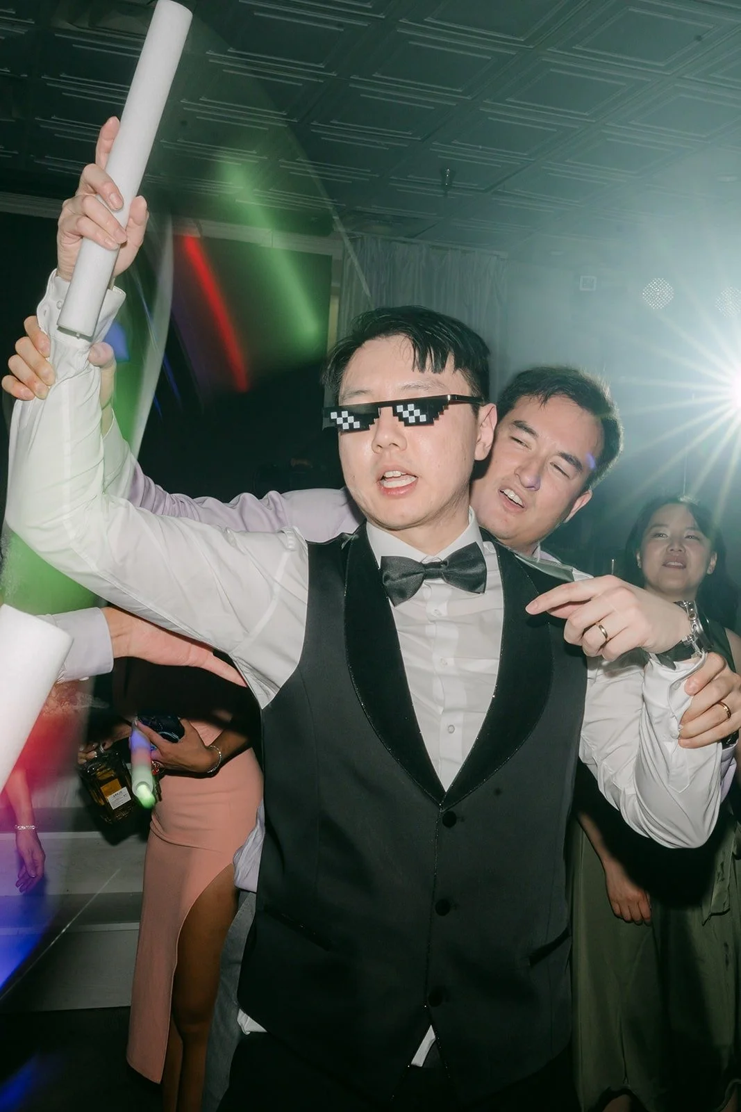 James in sunglasses with a glow stick, photographed by One and Only Production