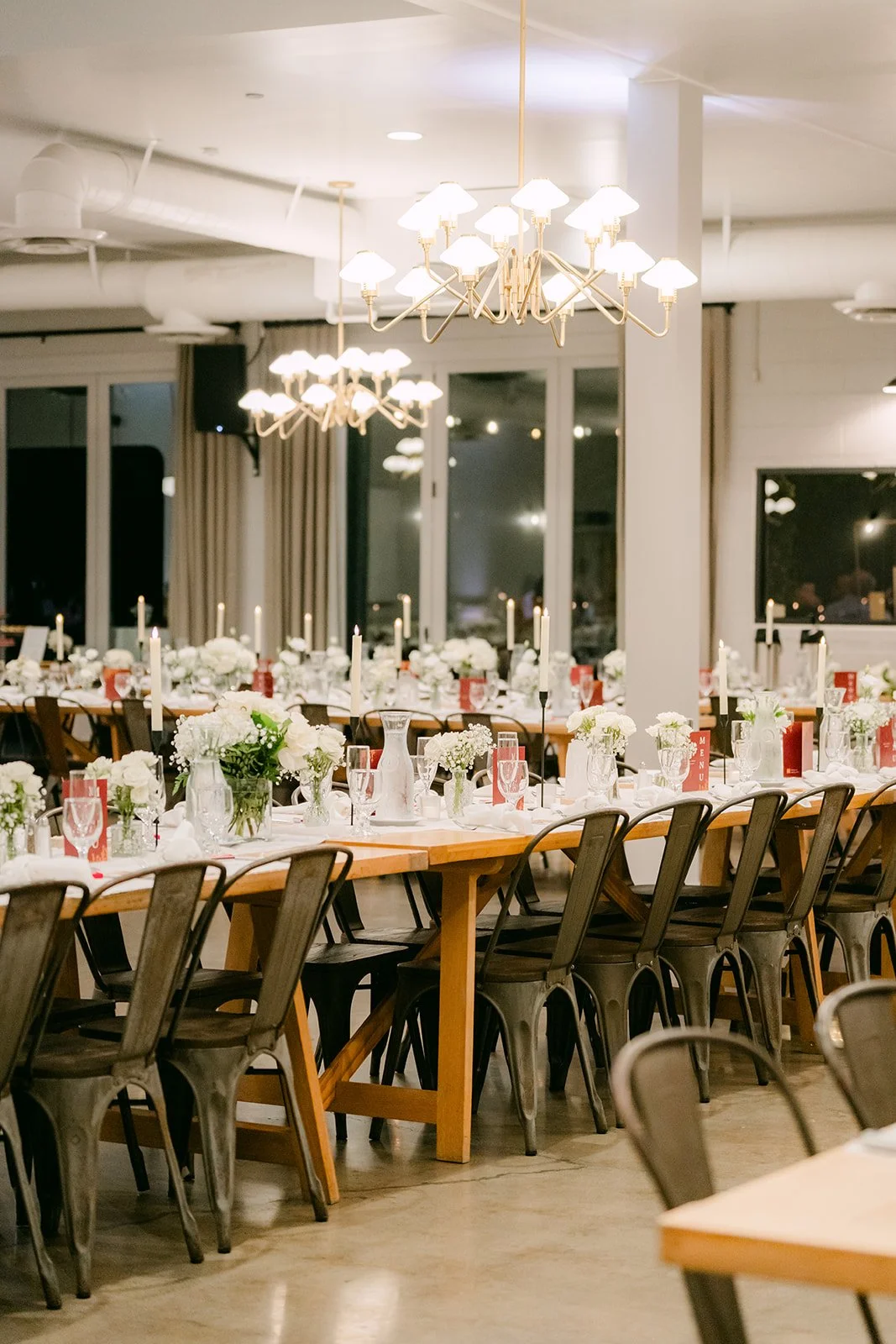 Long tables under the chandeliers in the reception room