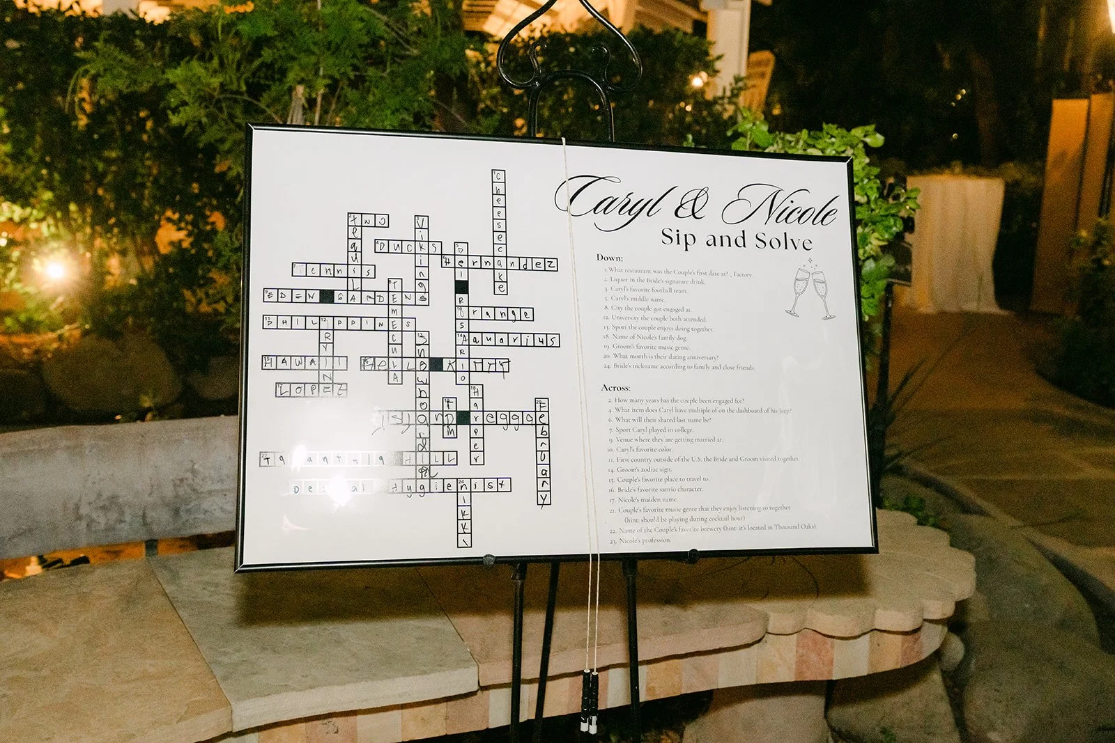 A crossword puzzle sign about Caryl and Nicole for guests at the reception.