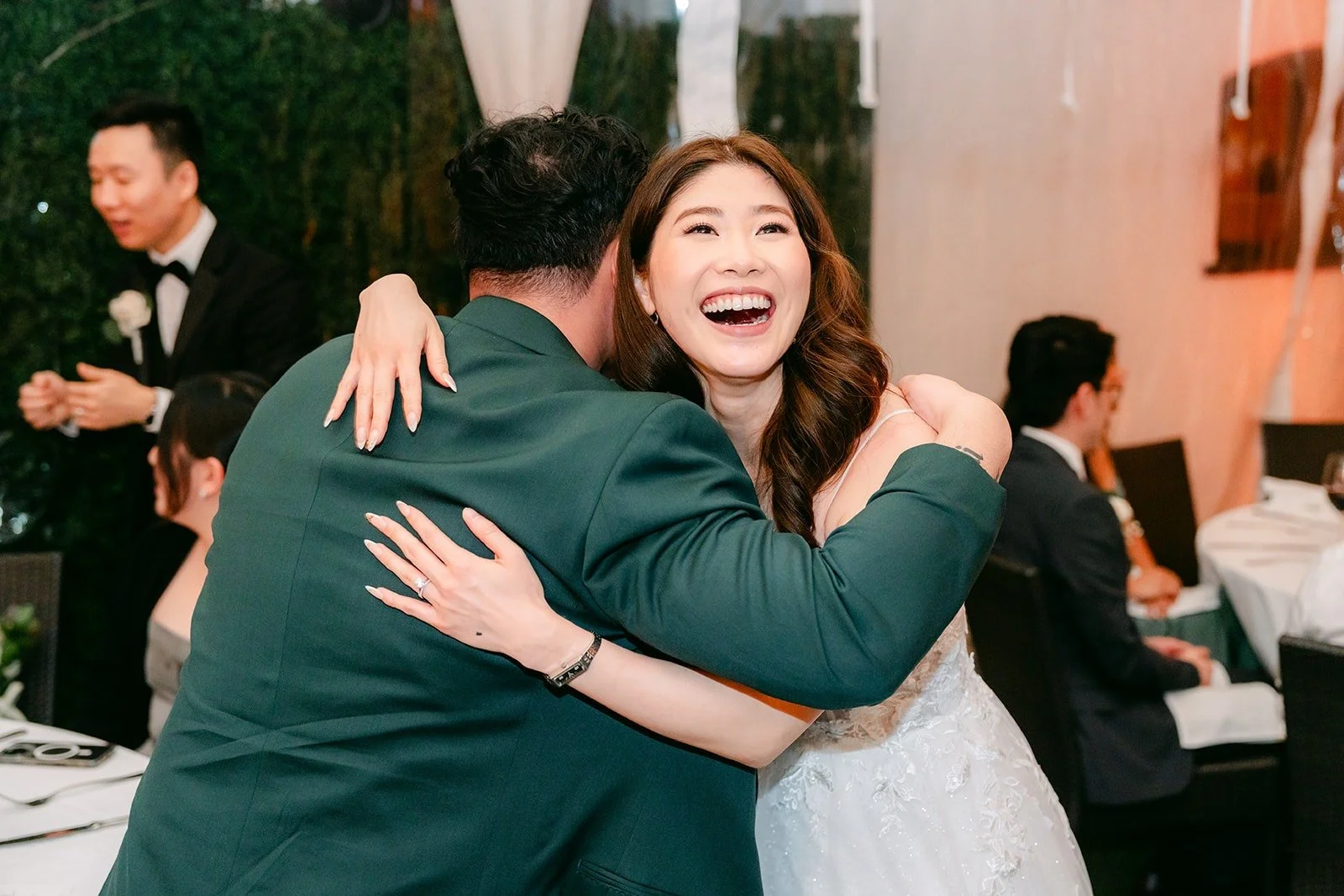 Valerie hugging a guest during table visits