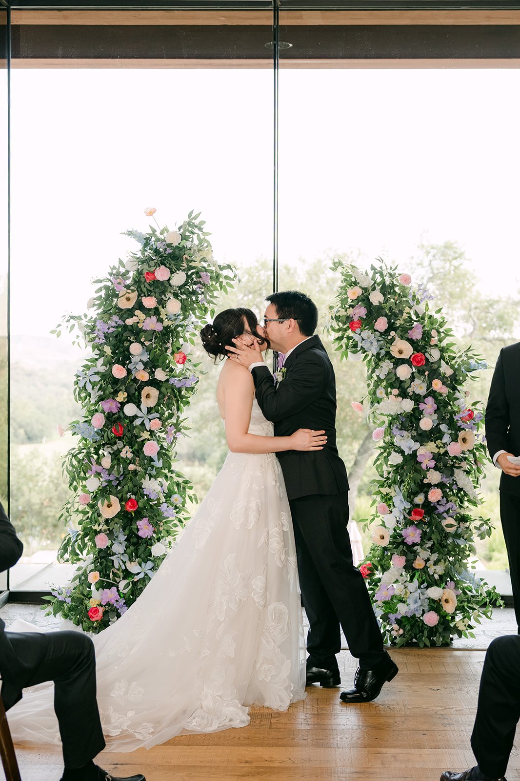 The first kiss between the floral columns