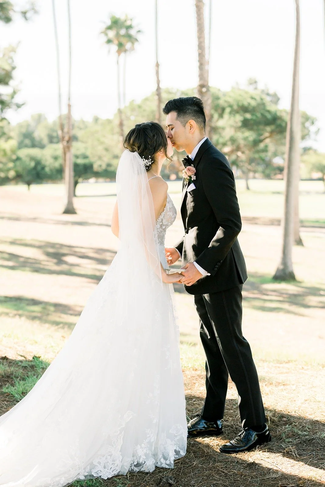 Josephine and David embracing on the golf course