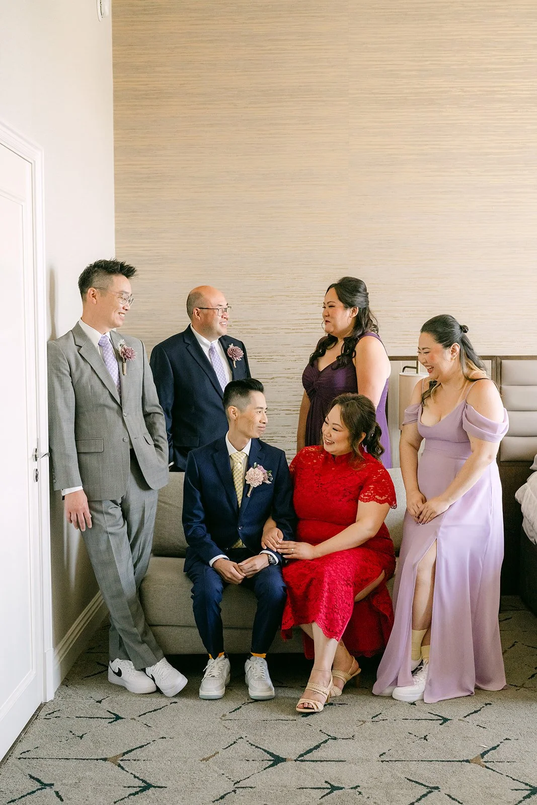 The wedding party with Mai in red.