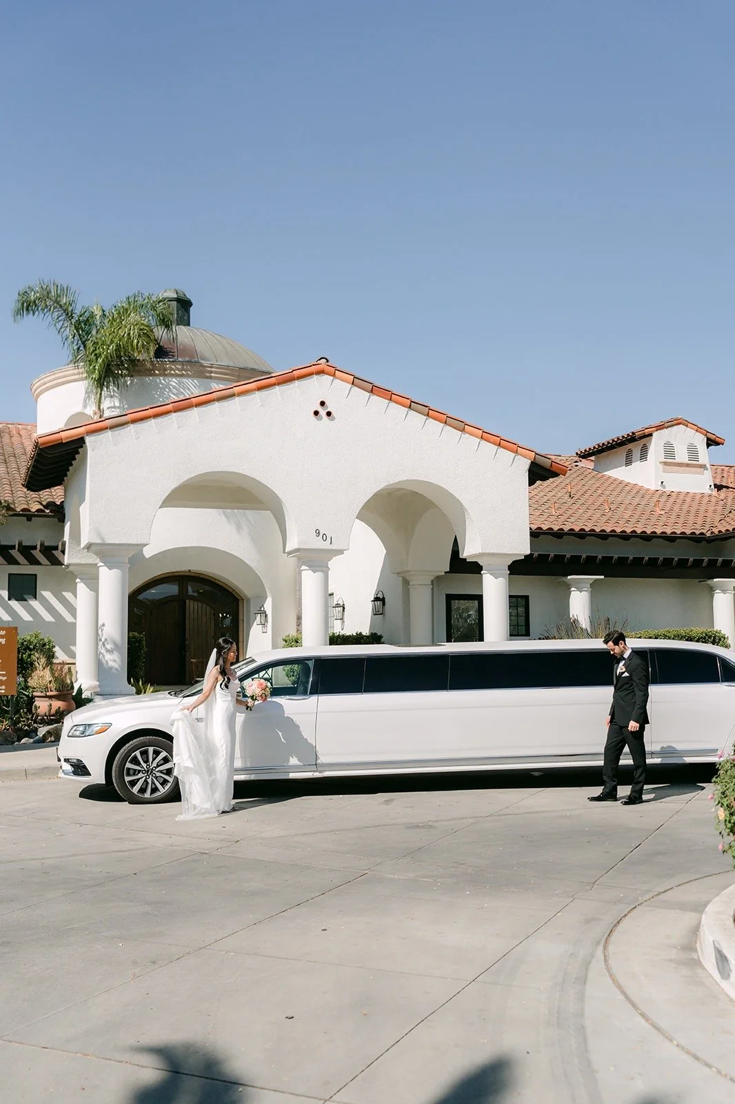 Stephanie and Kevin beside the white stretch limo outside Sterling Hills