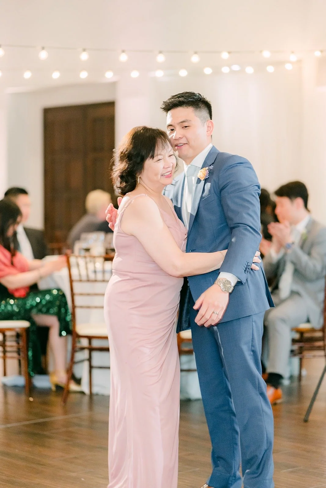Jerrick laughing during the parent dance, photographed by One and Only Production