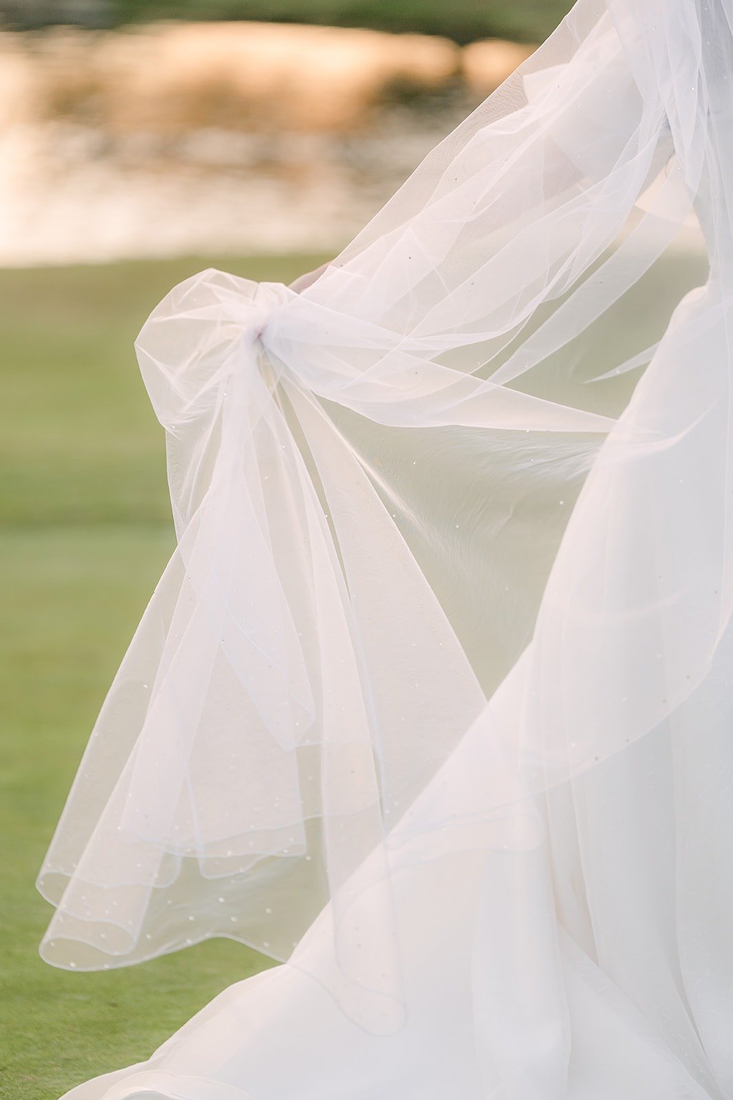 Jeannie's veil lifting in the breeze on the course
