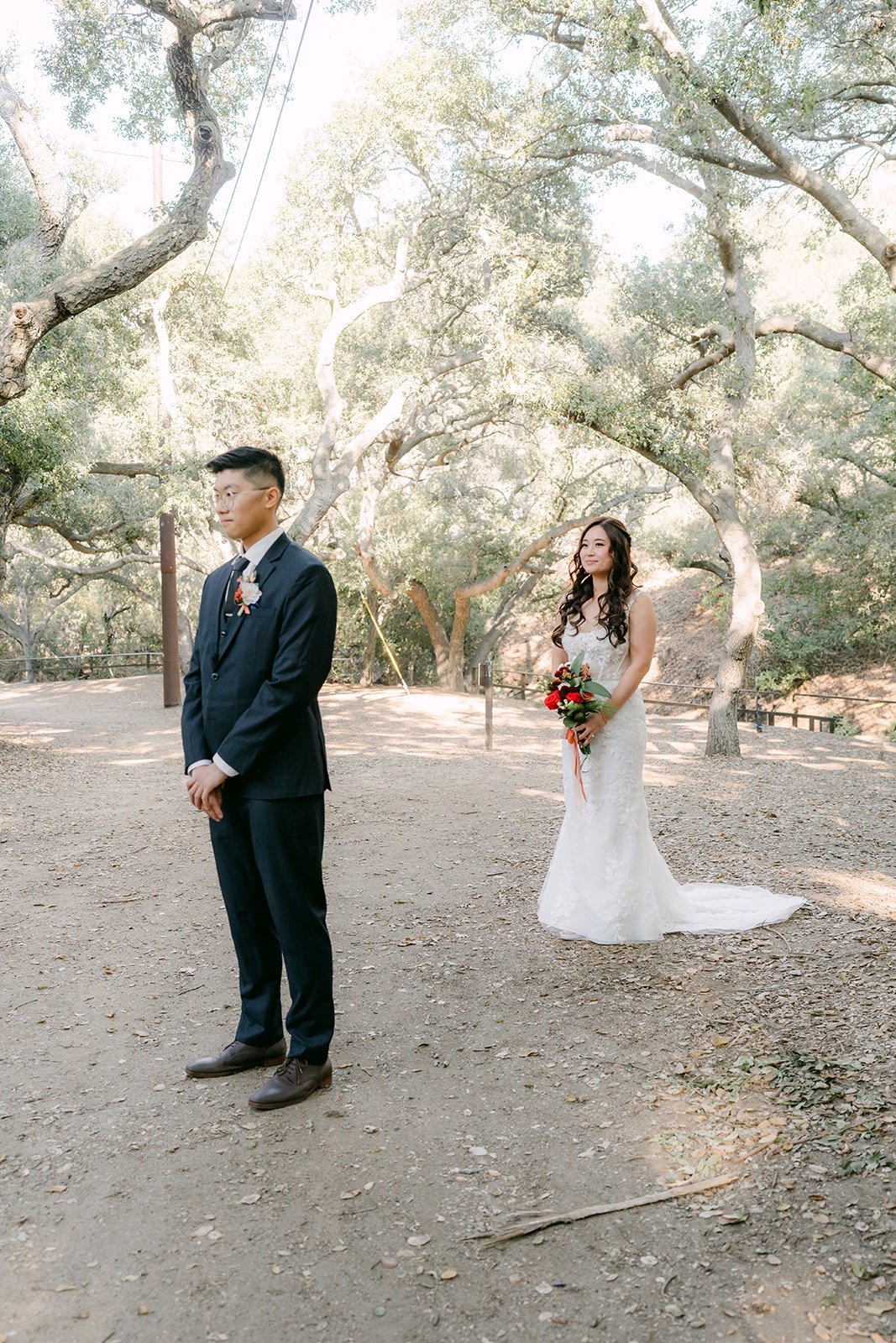 Shayna walks up behind Robert for their first look