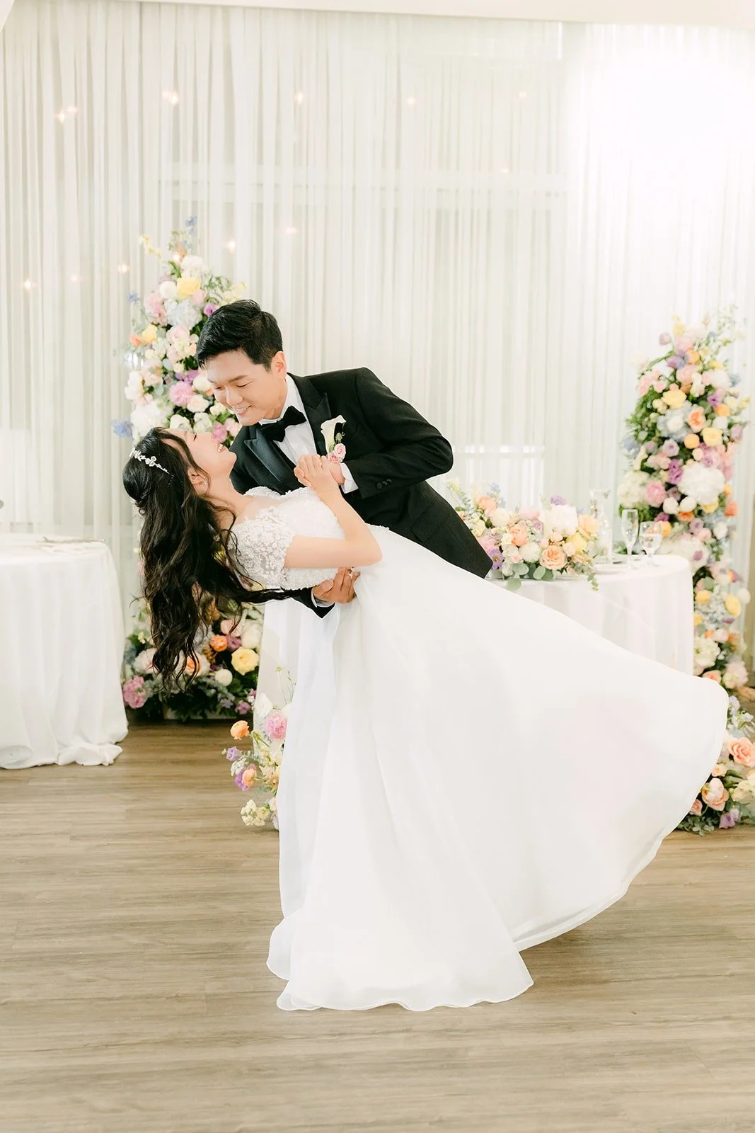 Jeannie leaning back in a dip during the first dance