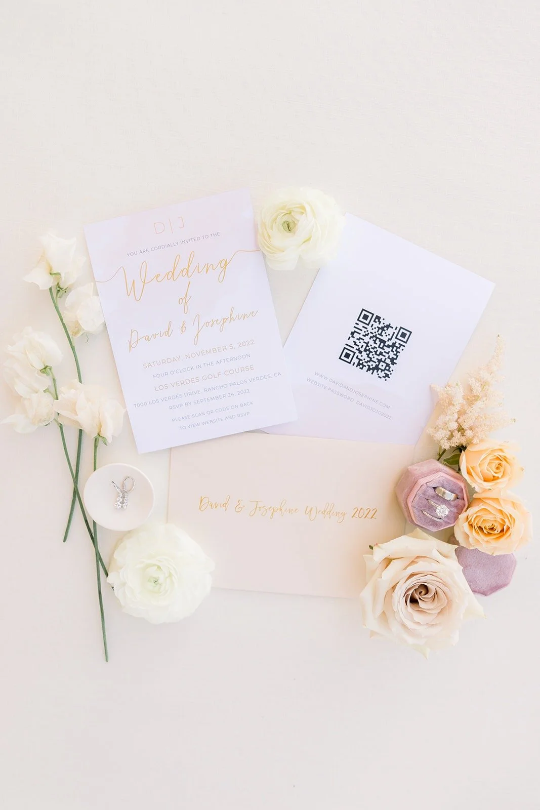 Josephine and David's invitation suite with ivory and peach roses