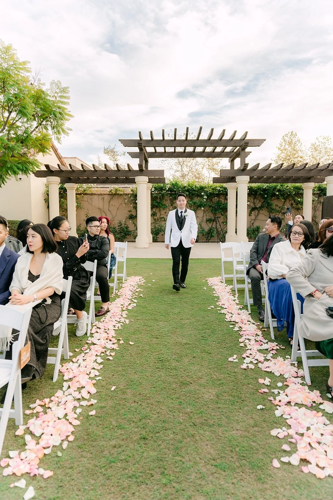 Chungman waiting at the end of the petal lined aisle