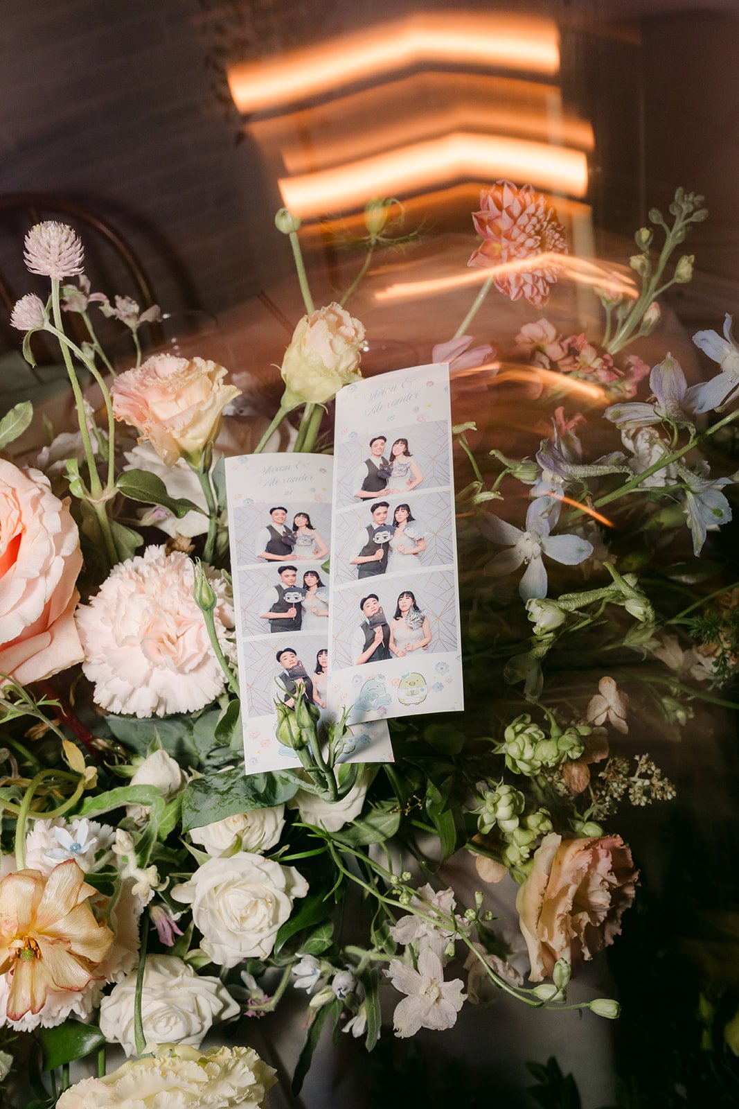 Illustrated couple sign tucked into florals