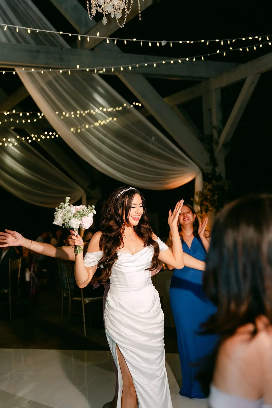 Sandra getting ready to toss a bouquet to the single ladies.