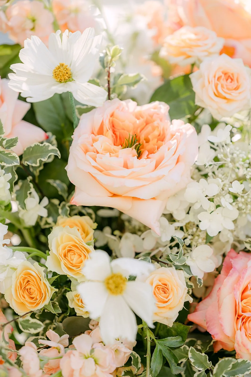 Peach and blush ceremony florals
