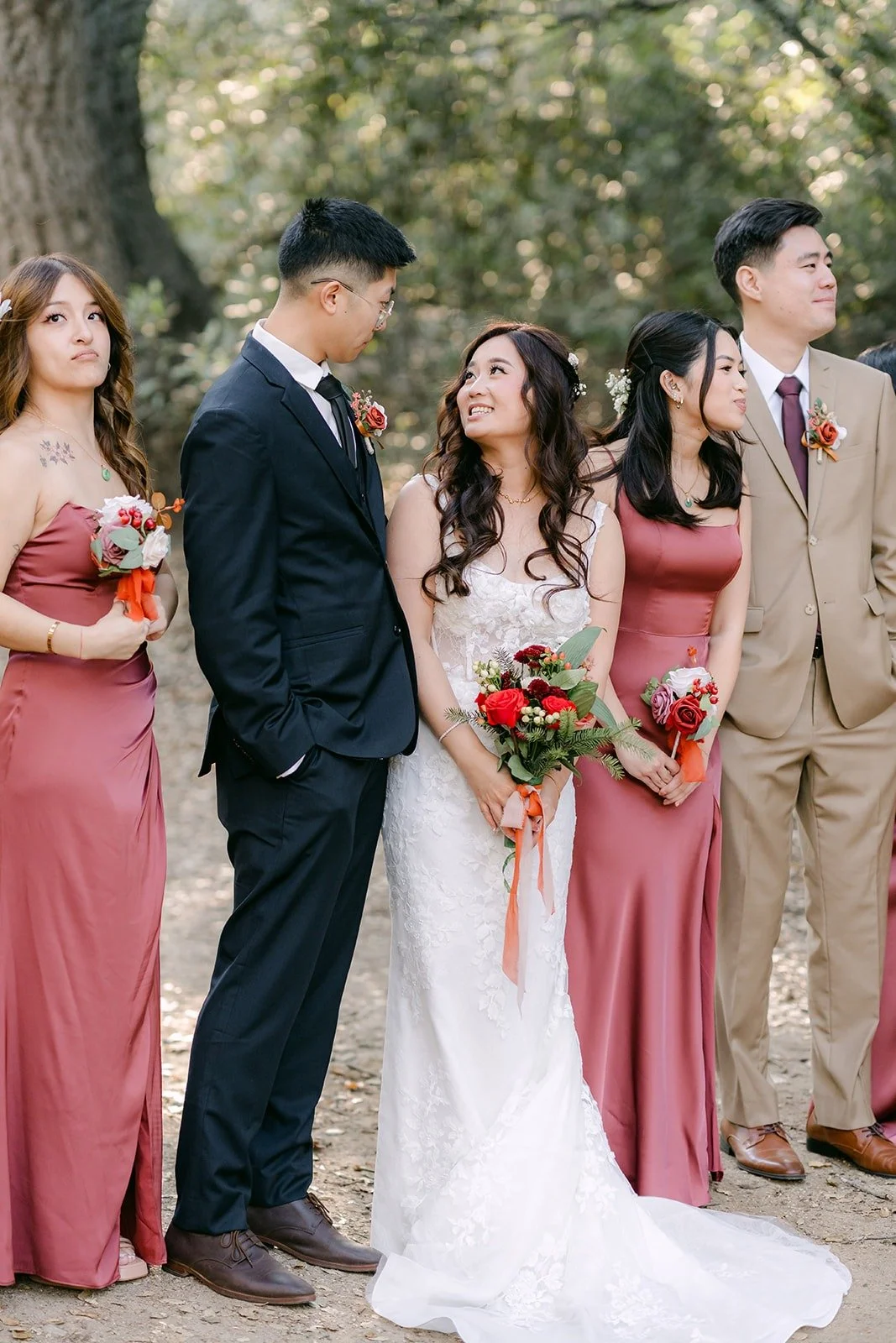 Shayna and Robert laughing with their wedding party