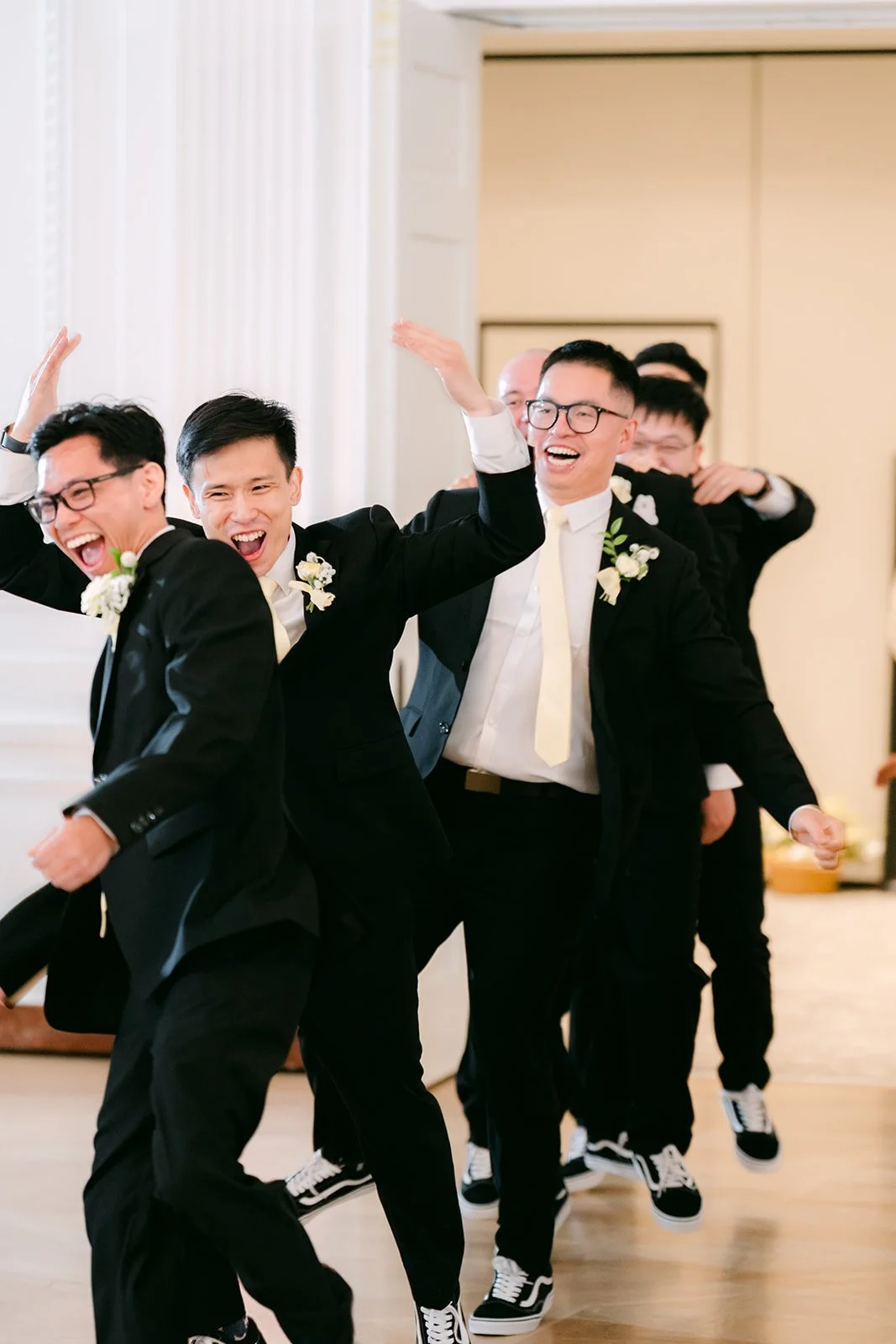 Groomsmen dancing into the reception for the grand entrance.