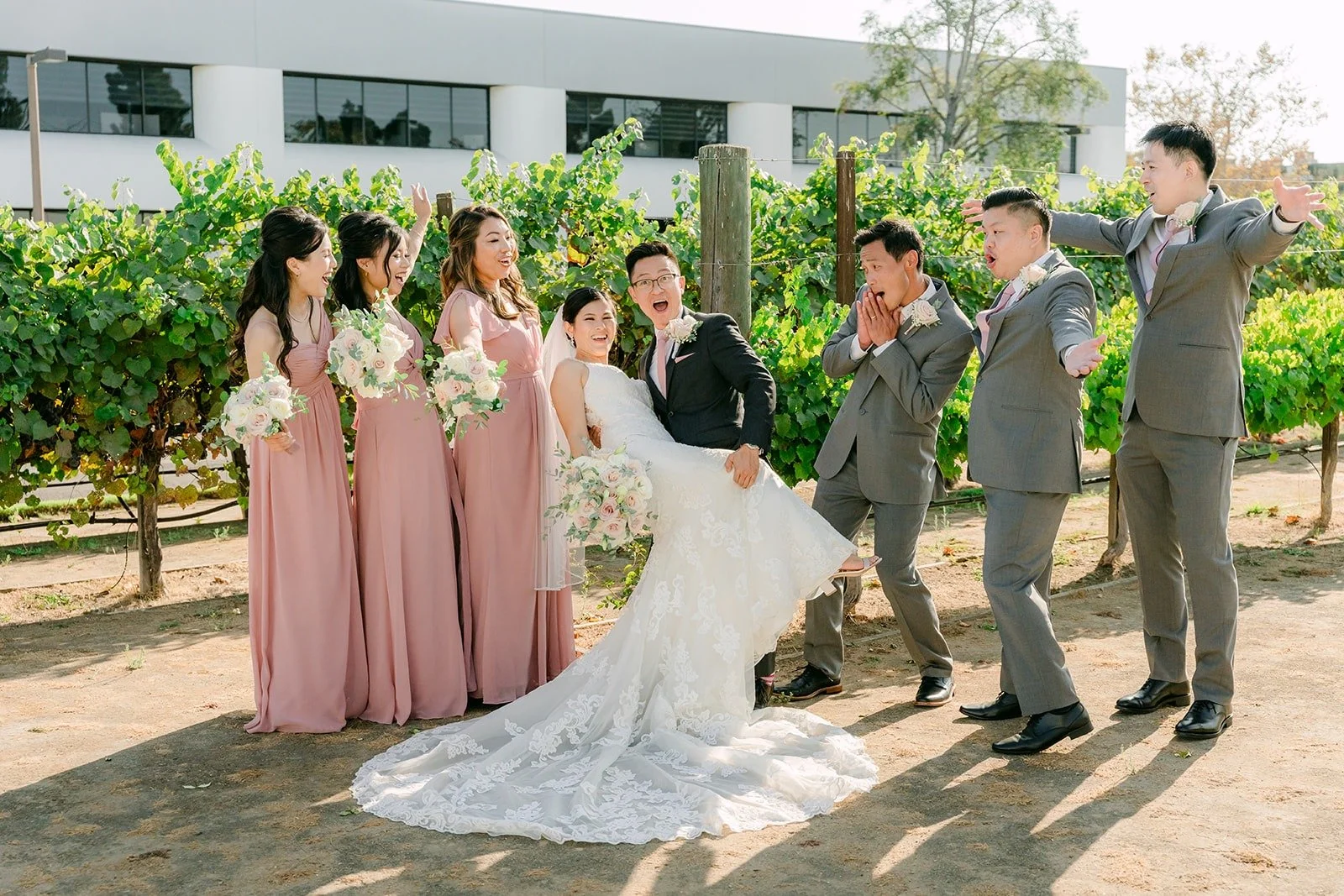 The wedding party cheering around Xuemin and Alex